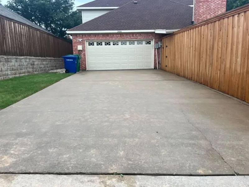 The same concrete driveway after pressure washing