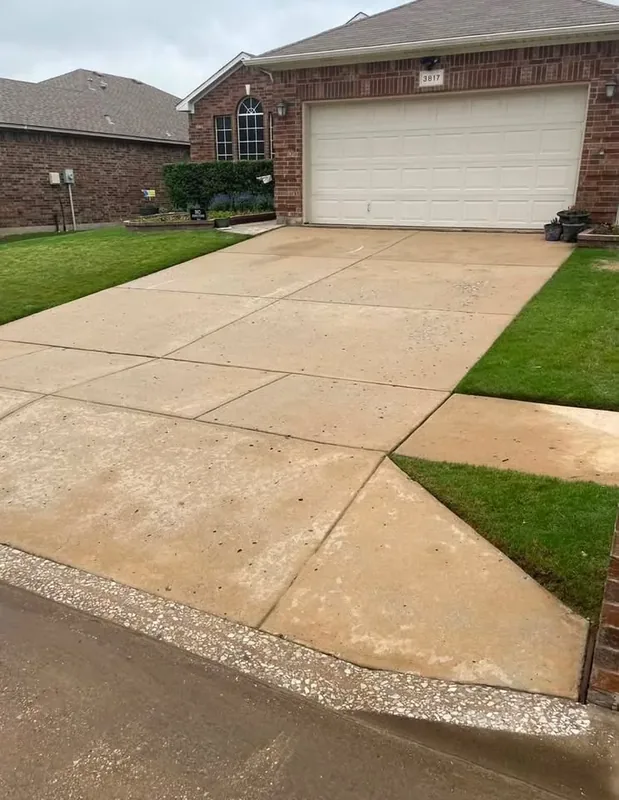 The same front driveway cleaned to an even colour after pressure washing