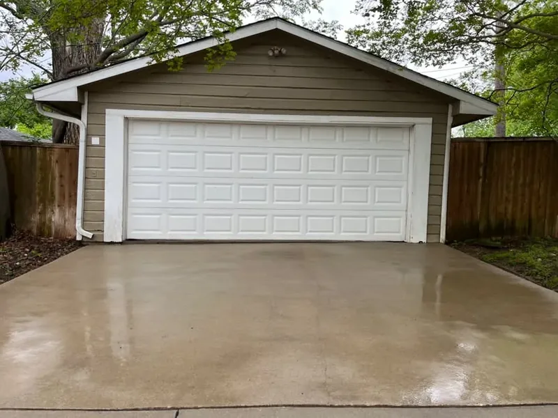 Detached garage driveway fully cleaned after pressure washing
