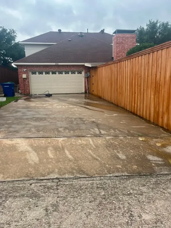 Stained concrete driveway before pressure washing