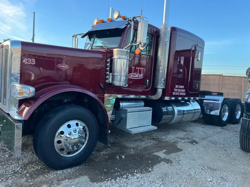 Maroon Peterbilt 389 sleeper cab after a semi-truck wash in the Dallas area